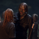 Negan (Jeffry Dean Morgan) gets his Whisperer mask... and a fire arrow.